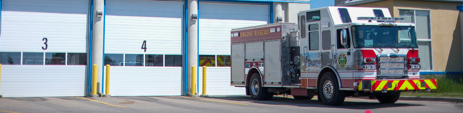 Okotoks Fire & Rescue truck in front of fire hall