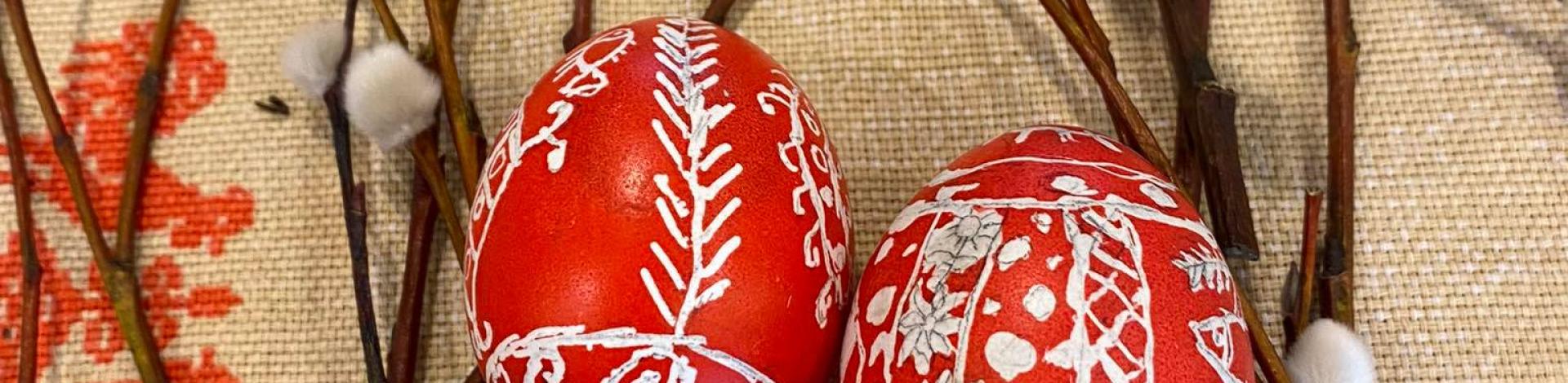 Red Easter eggs decorated with white lines. 