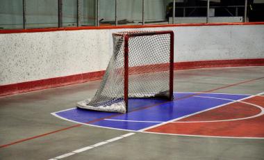 Hockey net on concrete arena surface