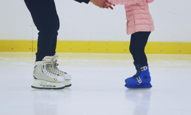 adult and child skating lower body only