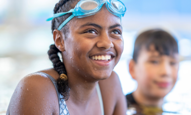 Smiling girl in swimming pool