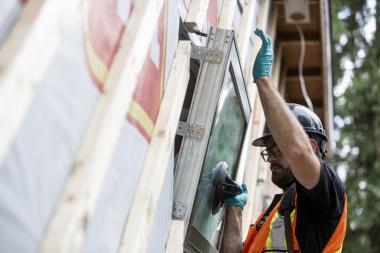 contractor installing a window 